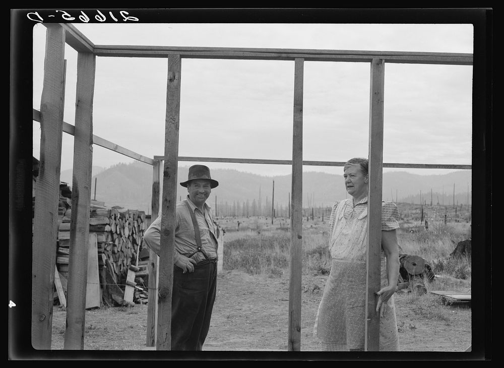 Farmer starting out on cut-over land building an addition to his one-room cabin. Priest River Valley, Bonner County, Idaho.…