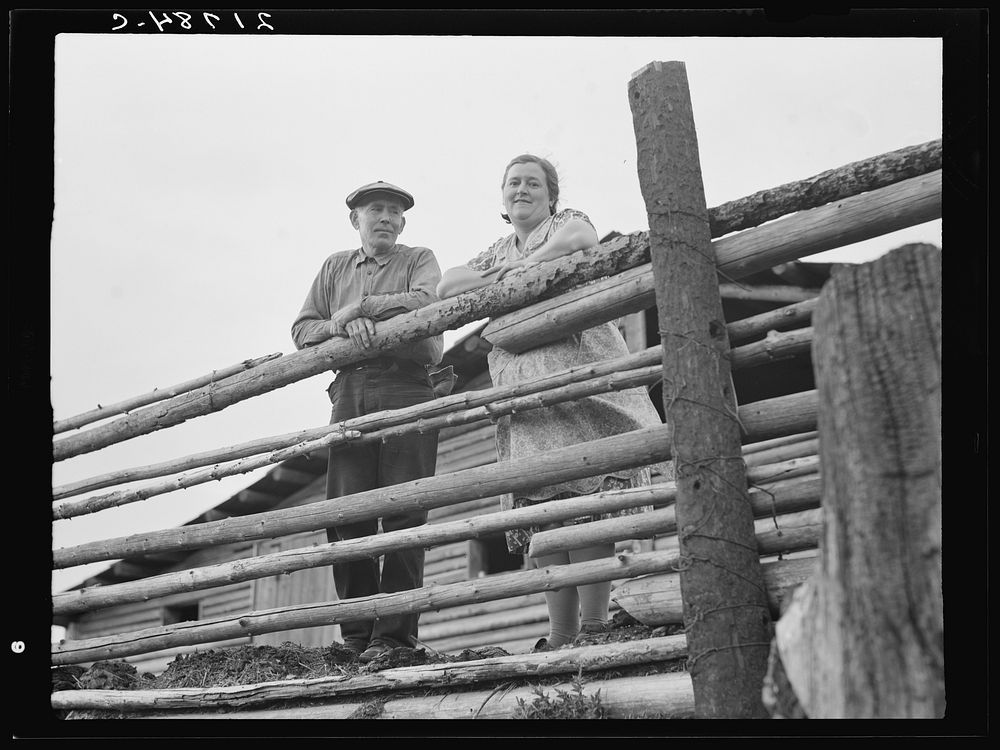 [Untitled photo, possibly related to: Stump rancher and wife. They and their seven children are making a new start on cut…