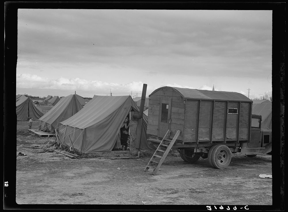 In mobile camp at end of season, cold day. Merrill, Klamath County, Oregon, FSA (Farm Security Administration) camp. Sourced…