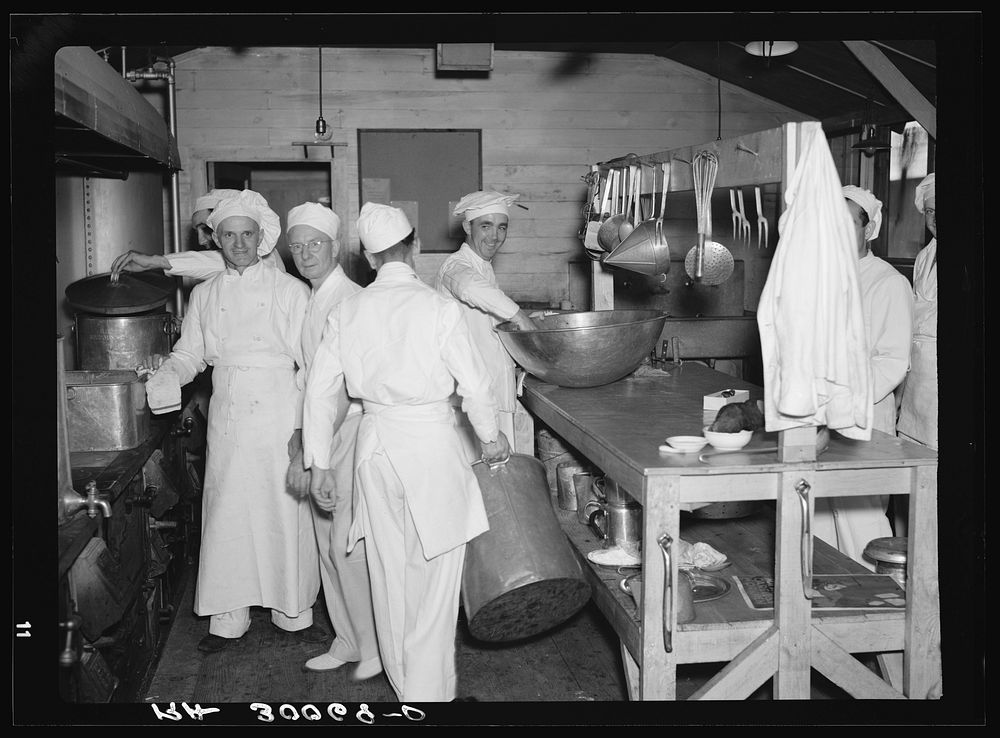[Untitled photo, possibly related to: Chefs and helpers in the camp kitchen. Allegan Project, Michigan] by Russell Lee