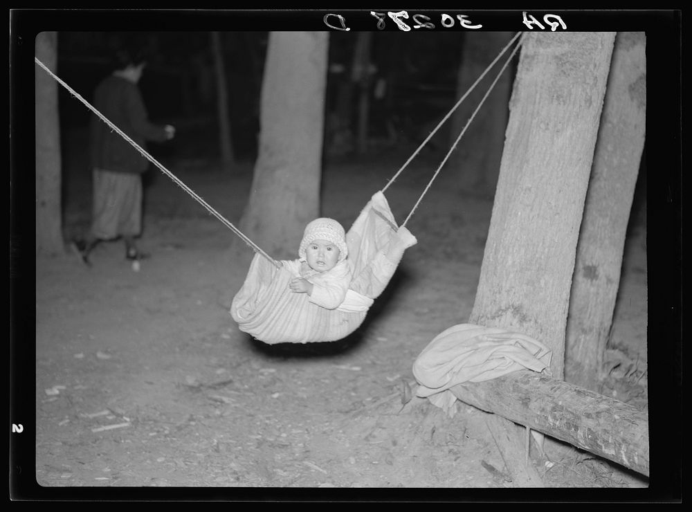 Indian baby in blueberry picker's camp. Littlefork, Minnesota by Russell Lee