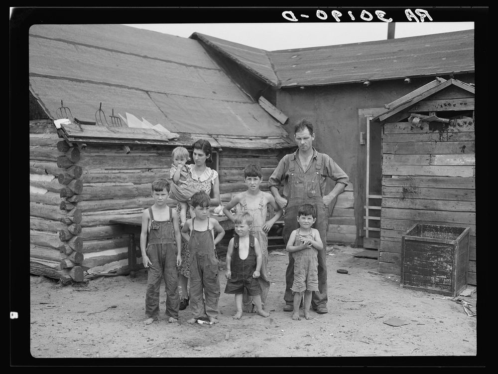 [Untitled photo, possibly related to: Art Simplot and family in front of their house near Black River Falls, Wisconsin] by…