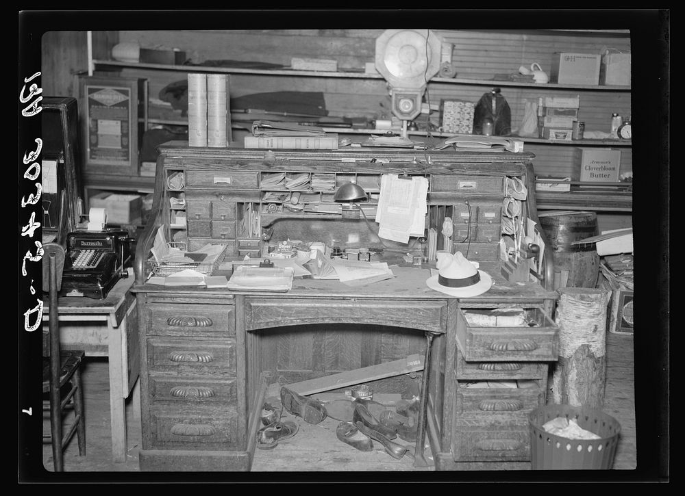 Desk of storekeeper. Ericsburg, Minnesota by Russell Lee