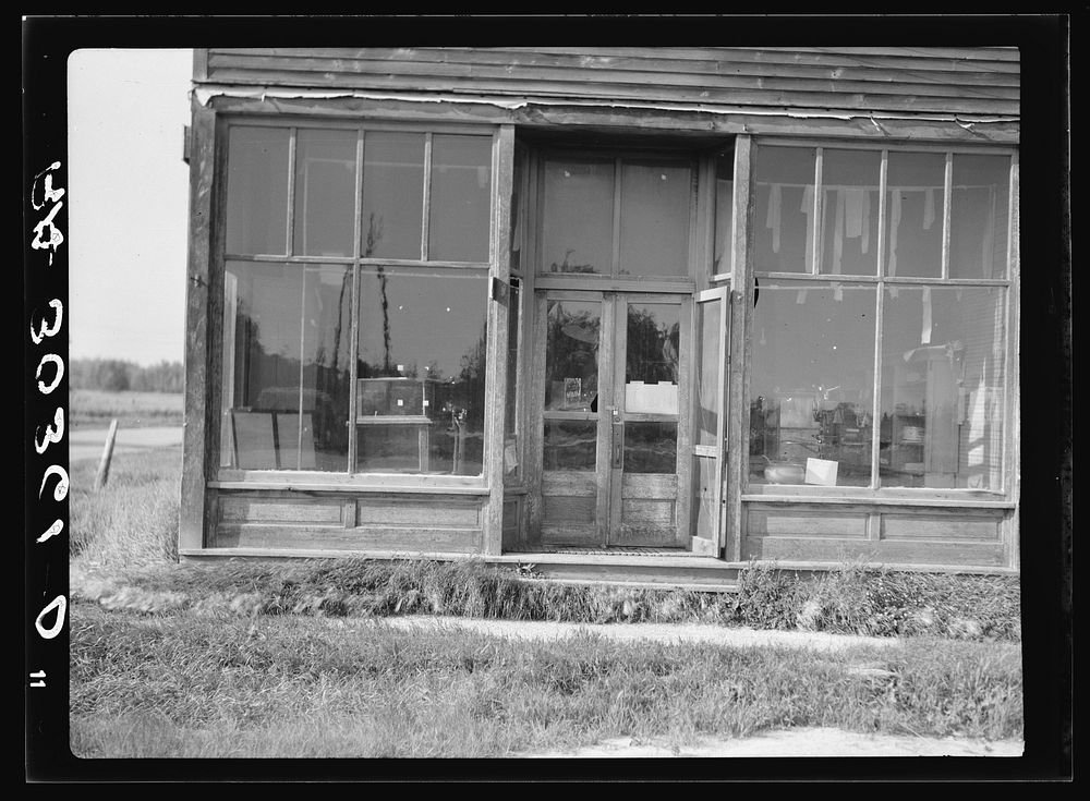Closed store in logging bust town. Northern Minnesota by Russell Lee