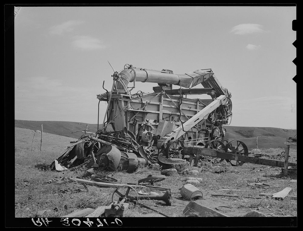 Old threshing machine on Herman Gerling's farm. There have been no crops for eight years. Near Wheelock, North Dakota by…