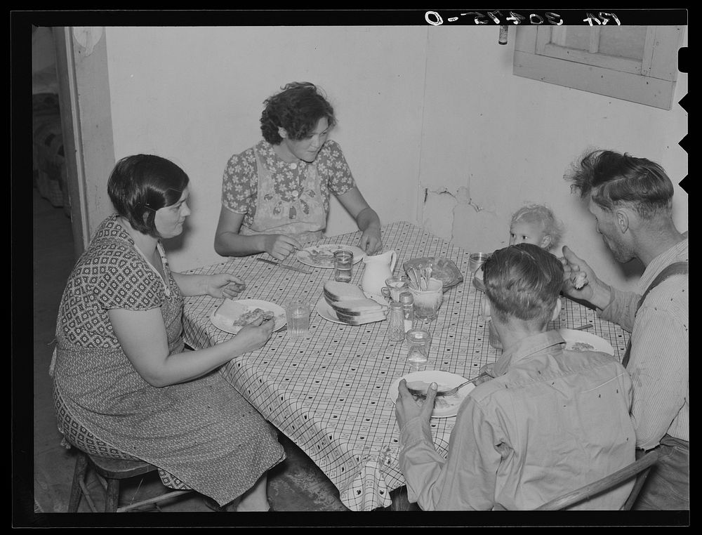 Family of E. Gorder eating dinner. Williams County, North Dakota by Russell Lee