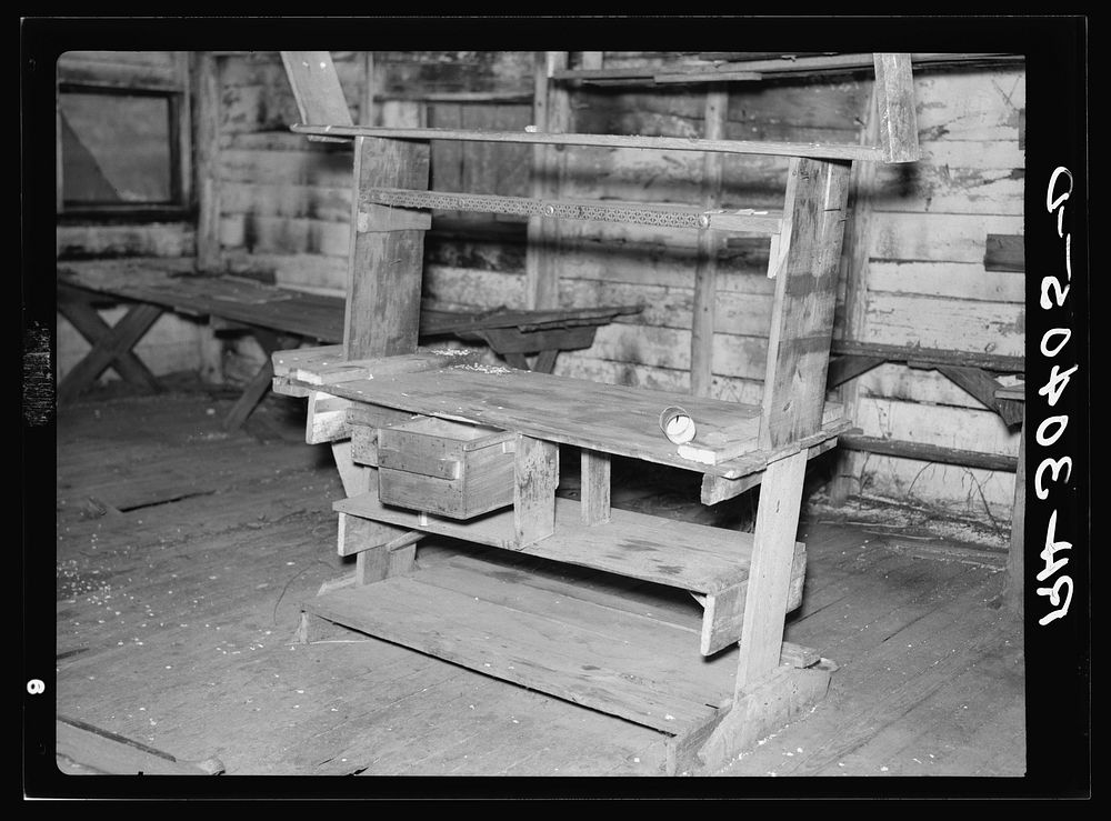 Serving table in former mess hall. Lumber camp at Craigville, Minnesota by Russell Lee