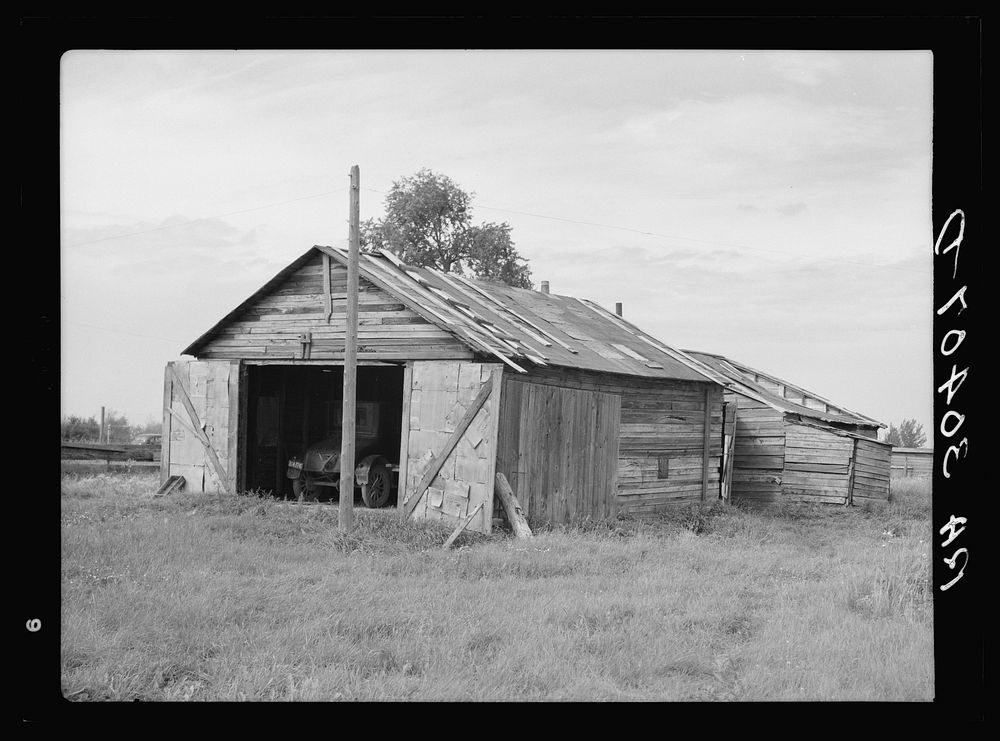 Buildings in old lumber camp. Gemmel, Minnesota by Russell Lee
