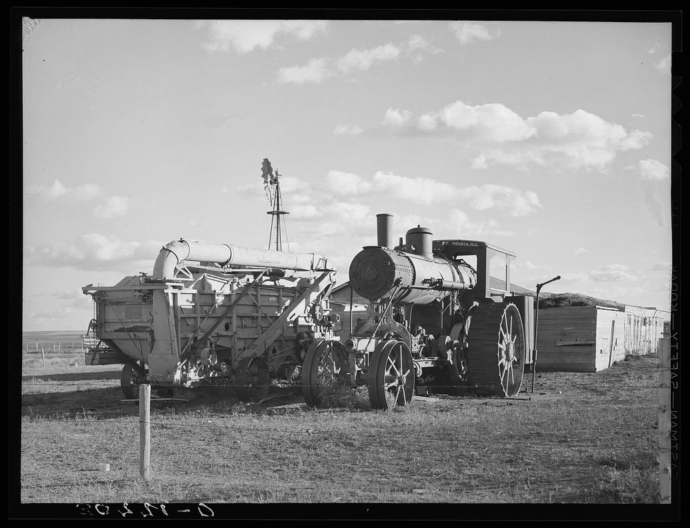 Old steam tractor and threshing machine, idle for nine years. Ellisville Township, Williams County, North Dakota by Russell…