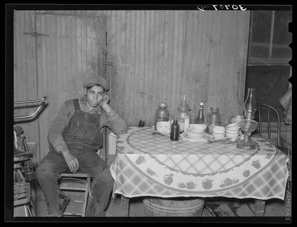 Mexican beet worker in his home near East Grand Forks, Minnesota by Russell Lee