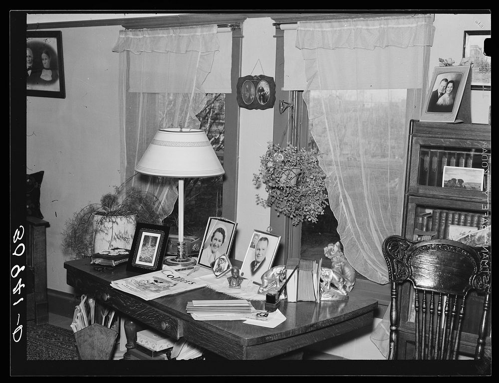 Living room table in the home of George Bolster, founder of Plentywood, Montana. Note Bible covered with doily by Russell Lee