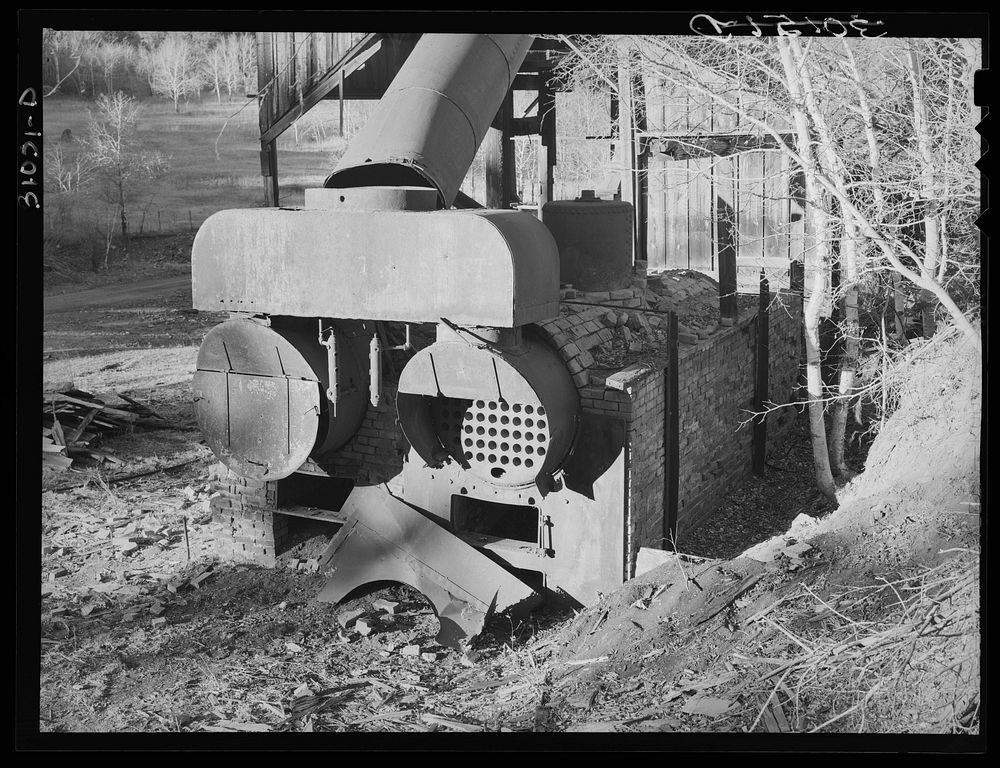 Old boiler at the Hardin mine near Two Bit Creek, near Deadwood, South Dakota by Russell Lee