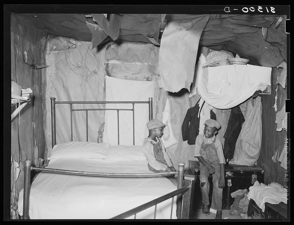 Bedroom in home of sharecropper who will work under tenant purchase program. Near Caruthersville, Missouri by Russell Lee
