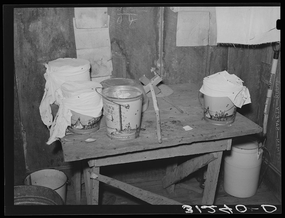 Southeast Missouri Farms. Top of table with pails and butter dasher in sharecropper shack by Russell Lee