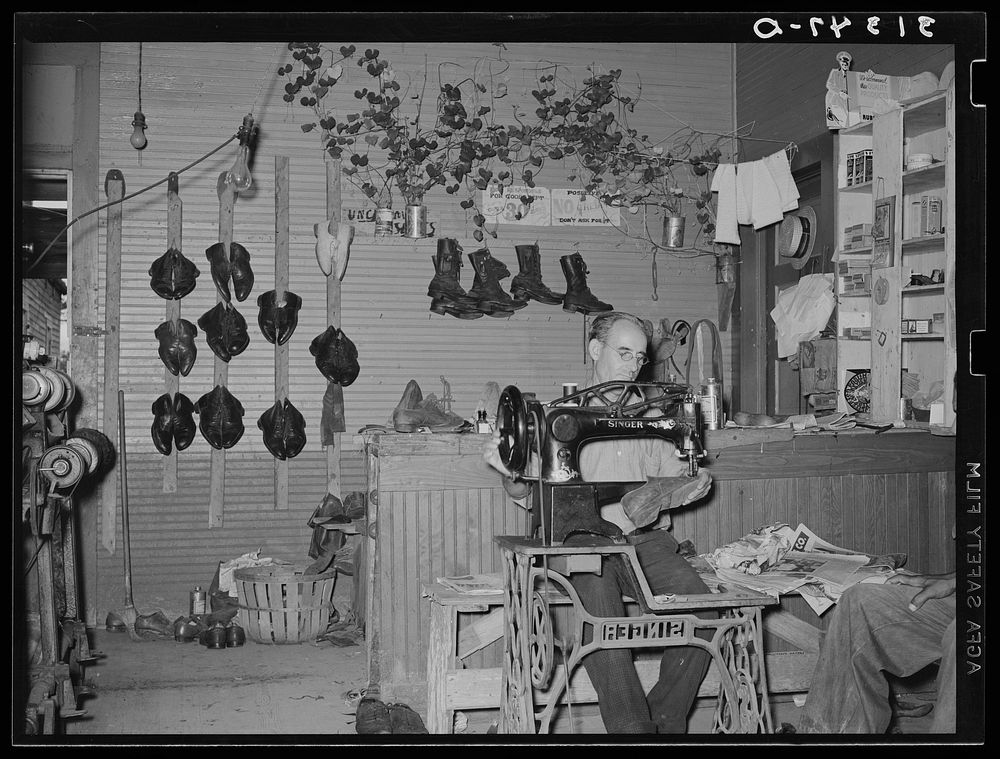 Shoemaker in his shop. Kenner, Louisiana by Russell Lee