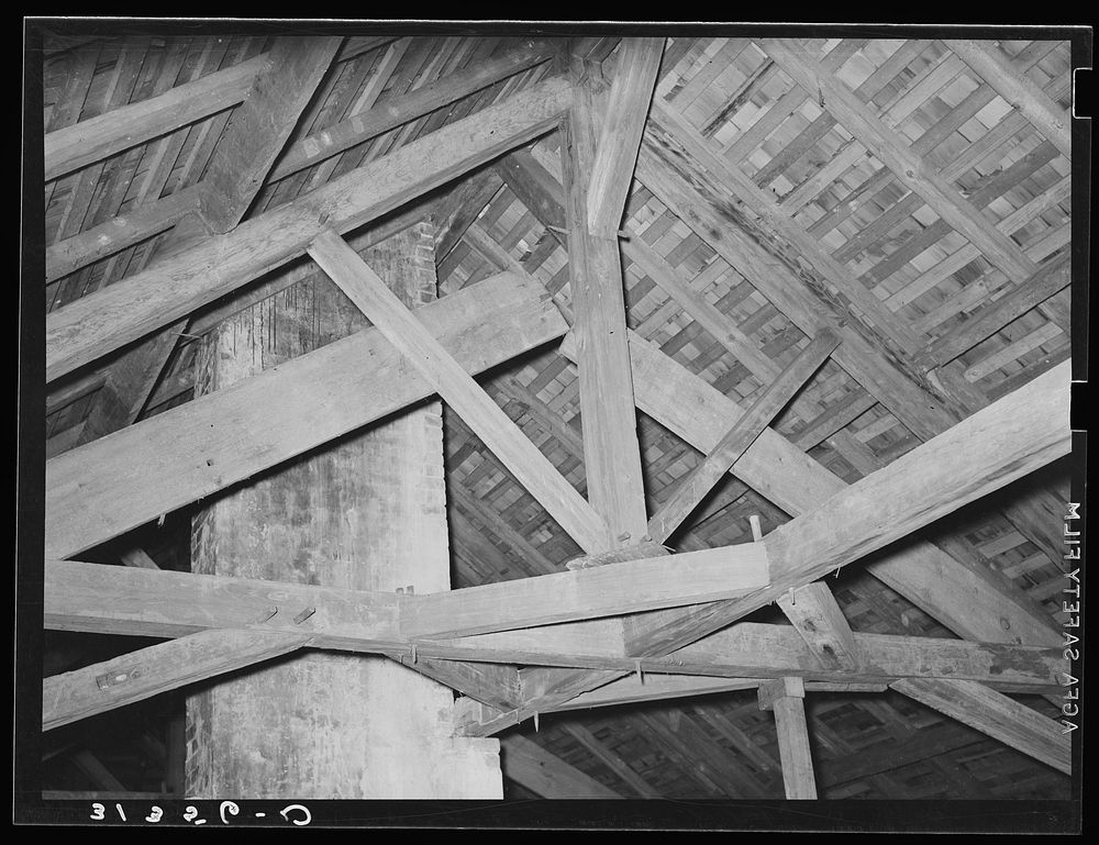 Rafters in old plantation house near New Orleans, Louisiana. Note that the timbers are joined with wooden pegs by Russell Lee