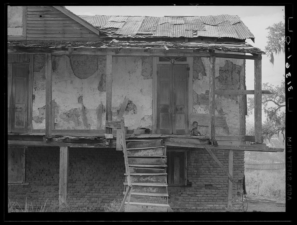 [Untitled photo, possibly related to: Abandoned Trepagnier plantation house now occupied by es. Louisiana] by Russell Lee