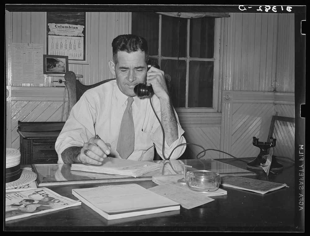 Mr. Schlicher, manager of state rice mill and chairman of National Rice Festival. Crowley, Louisiana by Russell Lee