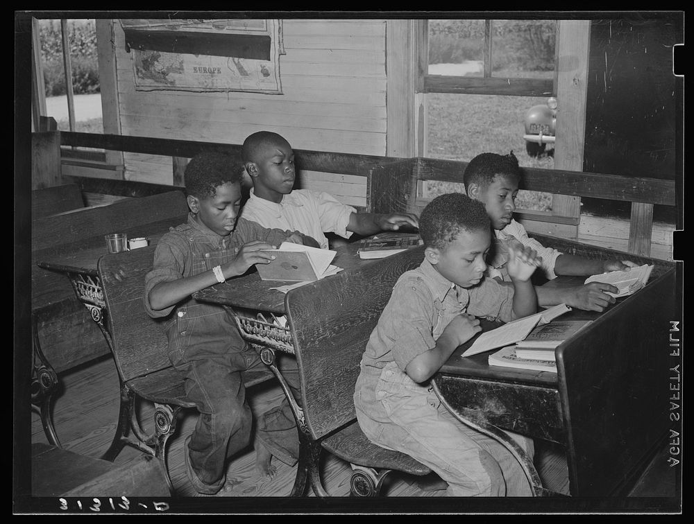 African American schoolchildren studying near southeast Missouri Farms by Russell Lee
