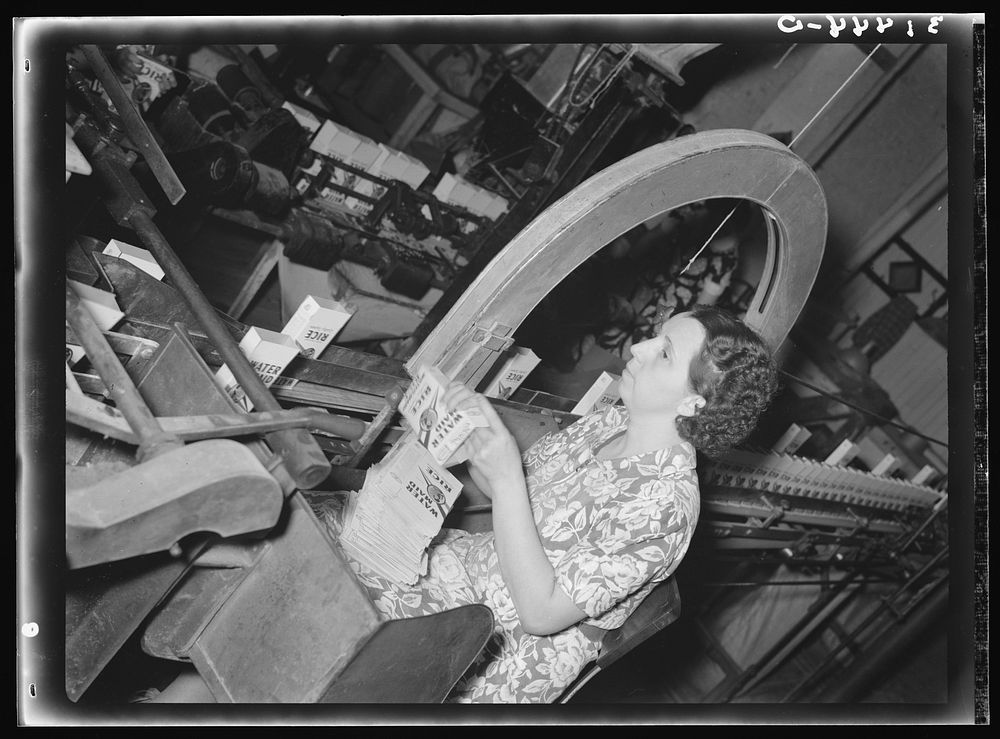 [Untitled photo, possibly related to: Removing packaged rice from conveyer. Ricemill, Abbeville, Louisiana] by Russell Lee