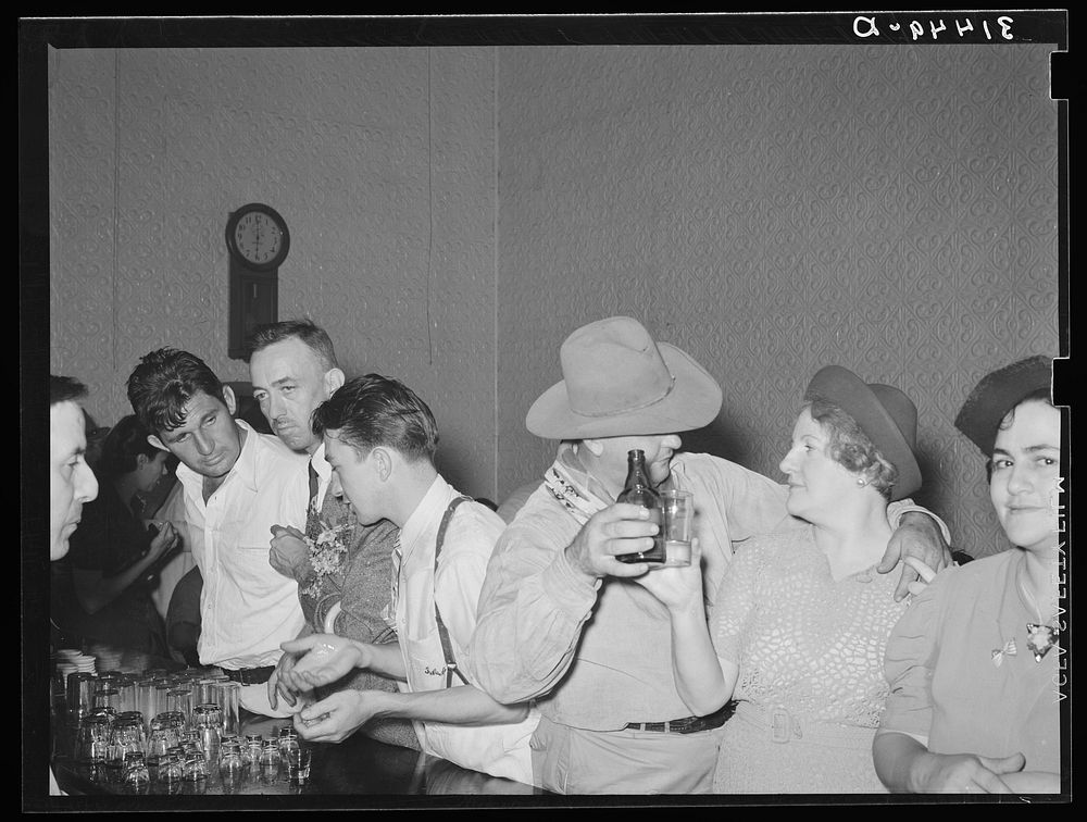 People in advanced stage of inebriation in saloon during National Rice Festival. Crowley, Louisiana by Russell Lee