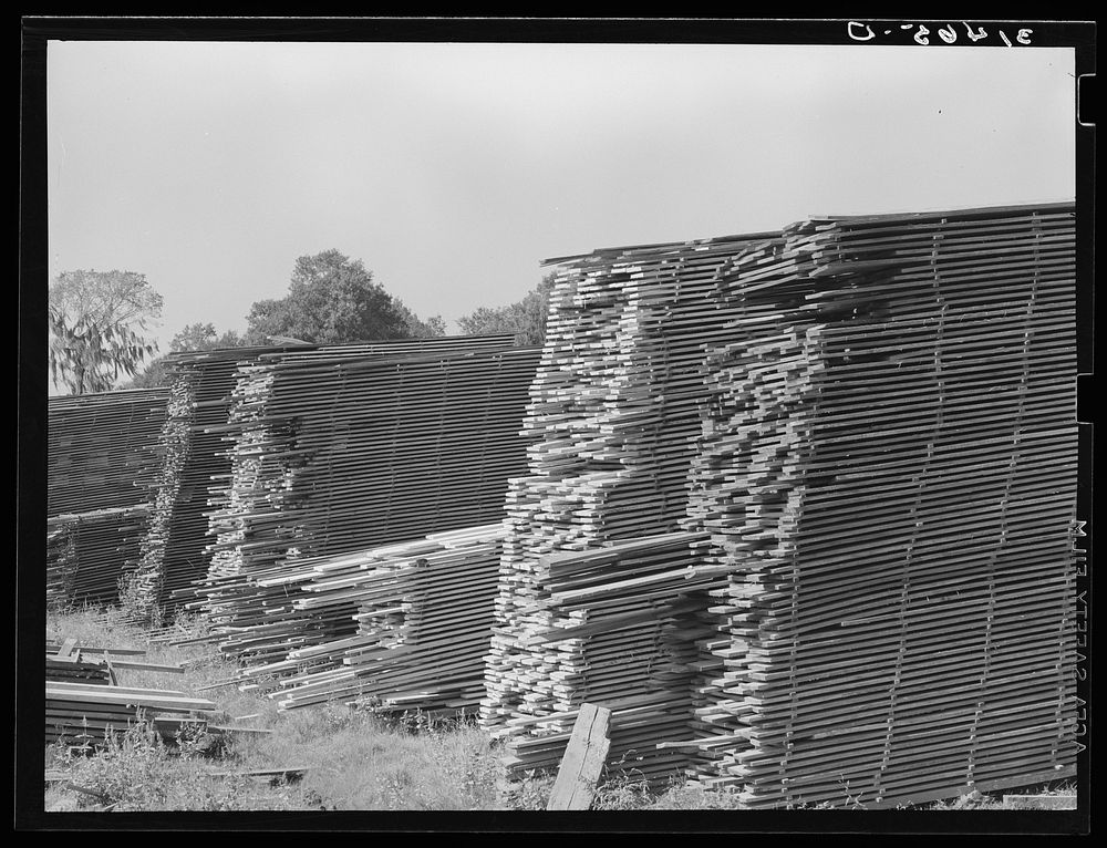 Piles of lumber in mill. Sorrento, Louisiana by Russell Lee