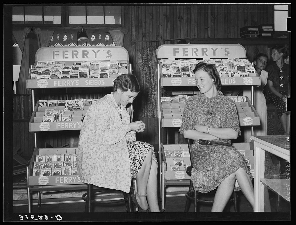 Wives of cooperative farmers sitting in cooperative general store waiting for the mail. Lake Dick Project, Arkansas by…