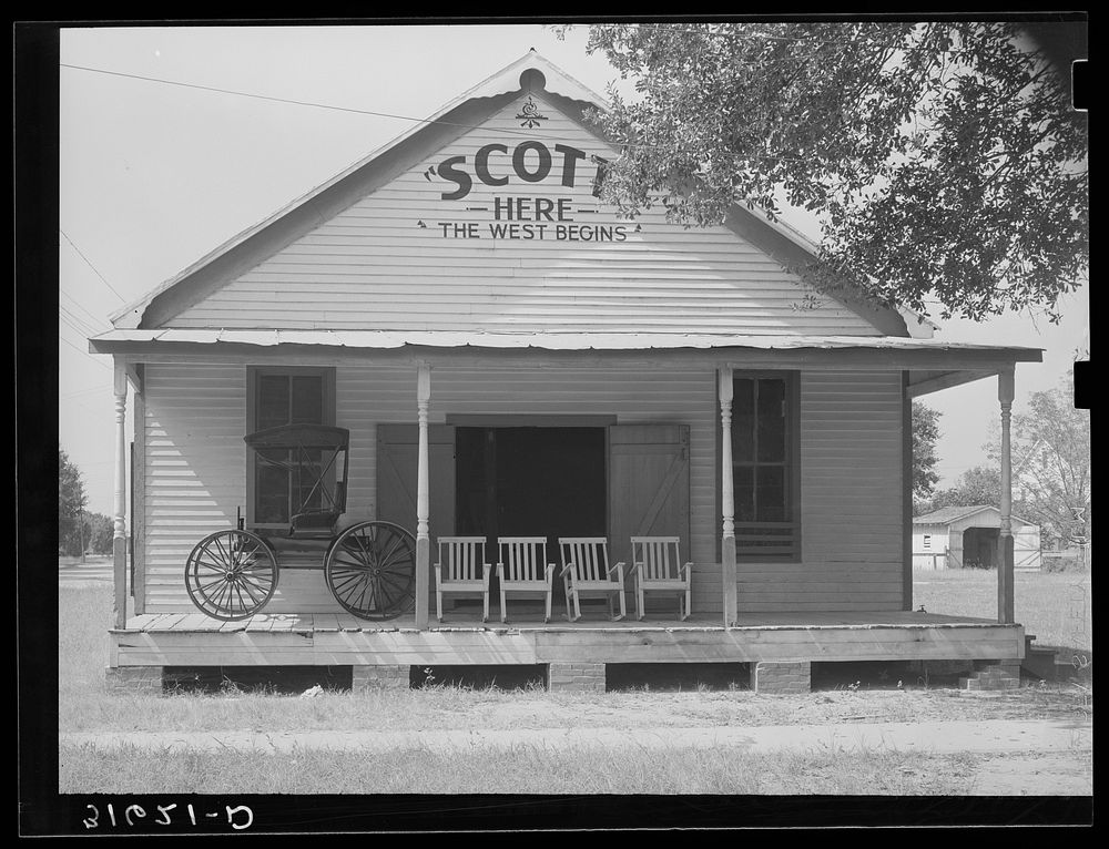 [Untitled photo, possibly related to: Building in Scott, Louisiana, proclaiming welcome to the West. This is on the O.S.T.]…