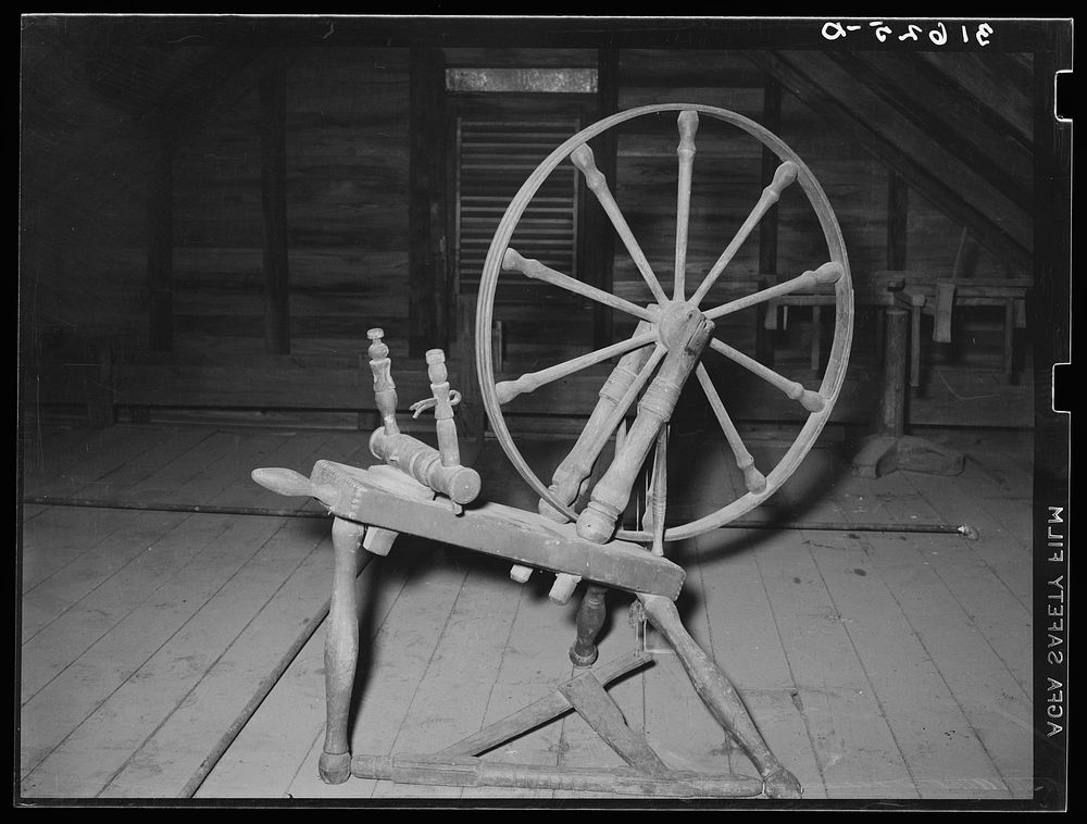 Spinning wheel in attic. Cajun farm home, Crowley, Louisiana by Russell Lee