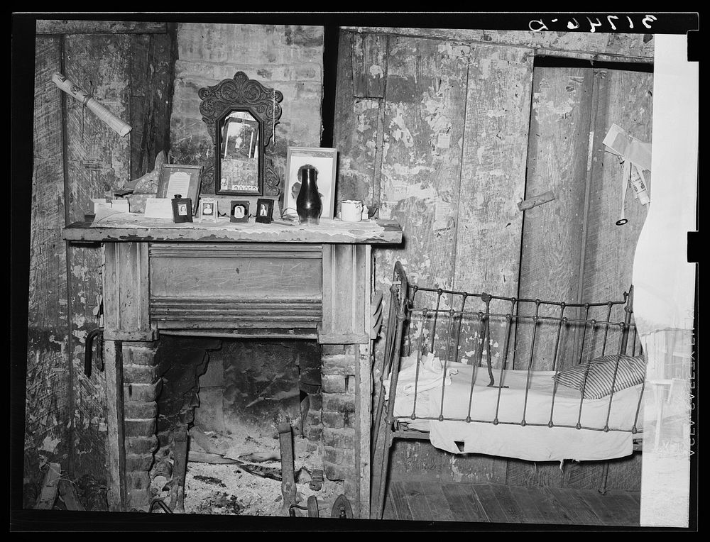 Fireplace and baby's crib in home of W.E. Smith, farmer near Morganza, Louisiana by Russell Lee