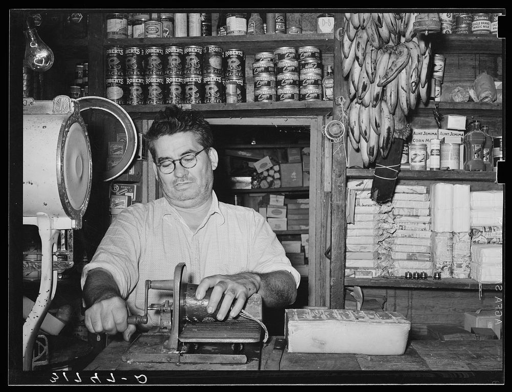 Owner of general store slicing baloney. Jarreau, Louisiana by Russell Lee