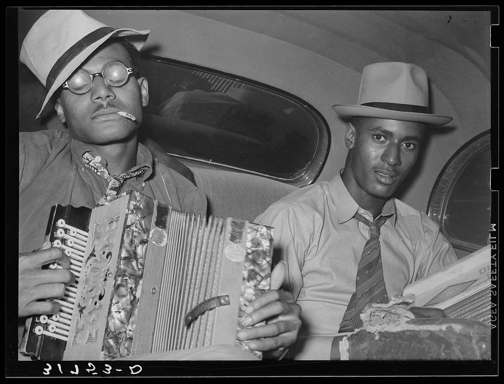 African American musicians playing accordion and washboard in automobile. Near New Iberia, Louisiana Unlink by Russell Lee