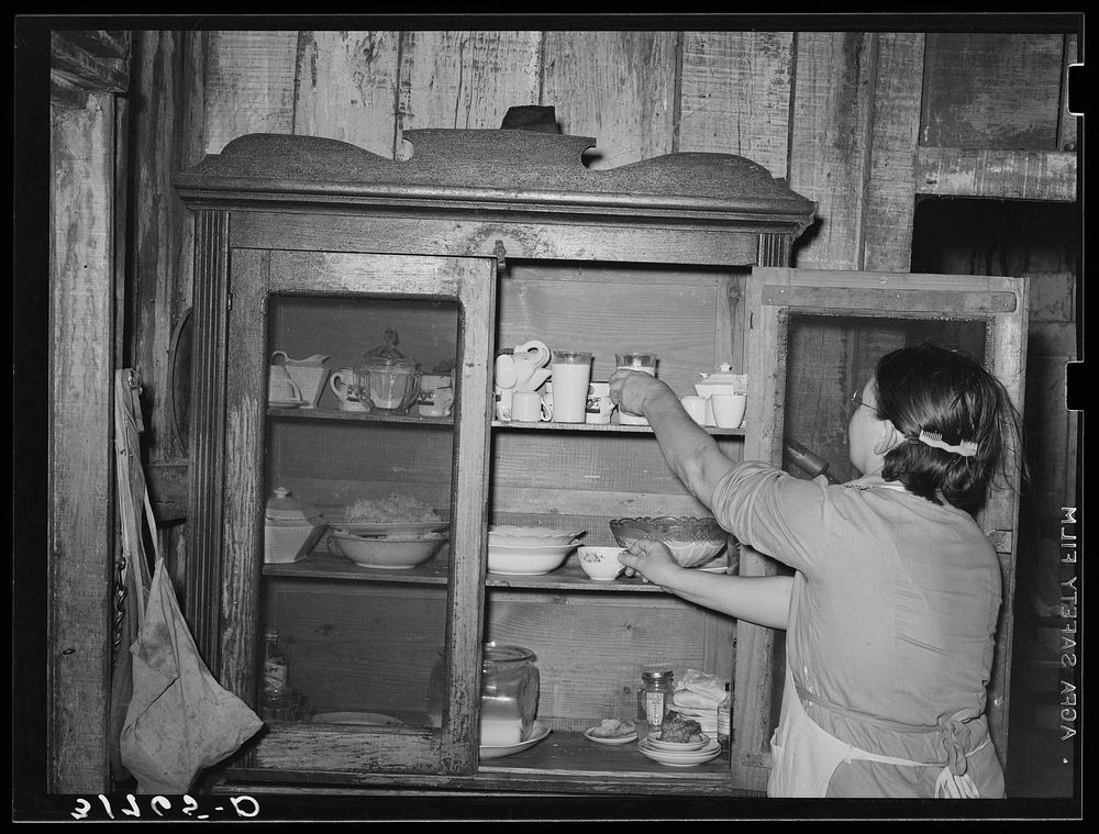 Mrs. M. LaBlanc removing supplies from screened safe. Because of general lack of screens in the house, it is necessary that…