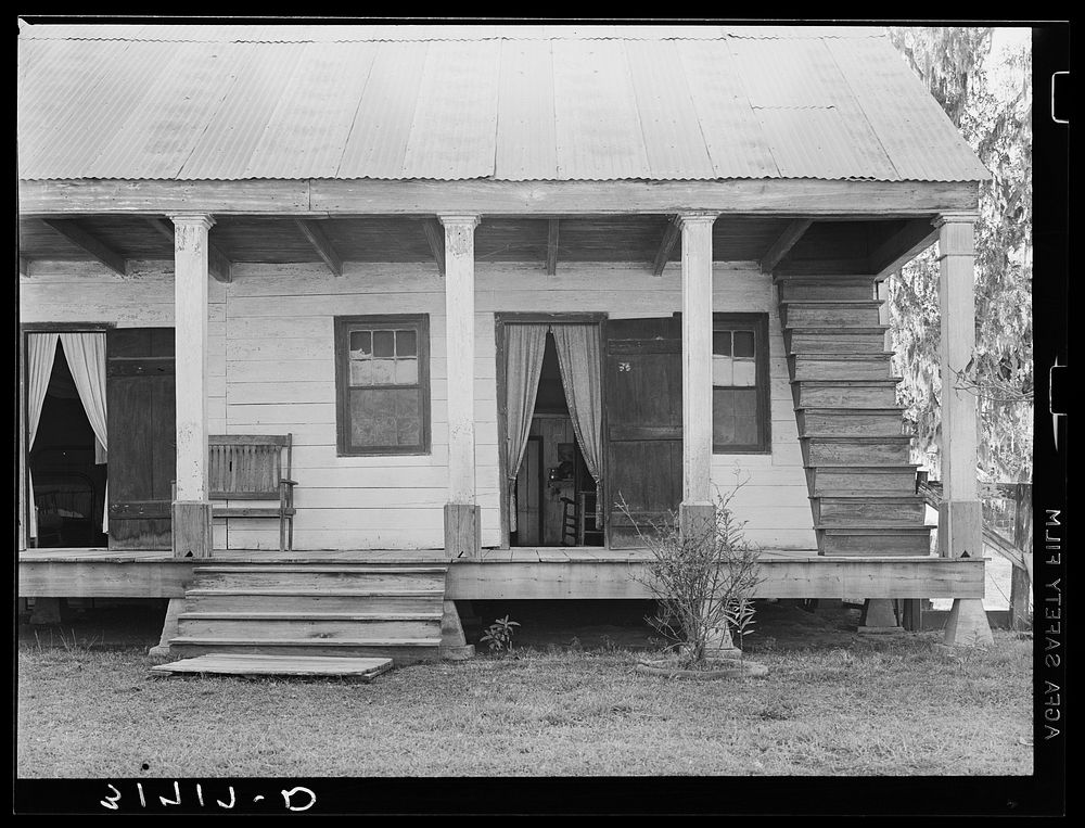 Detail of house with outside stairway to attic. Near Breaux Bridge, Louisiana by Russell Lee