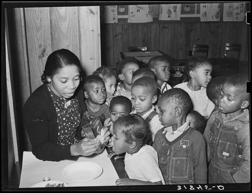 Children in nursery school getting cod liver oil. Lakeview Project, Arkansas by Russell Lee