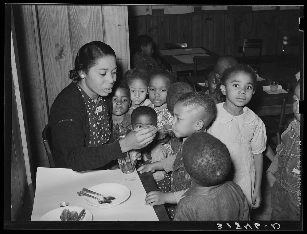 [Untitled photo, possibly related to: Children in nursery school getting cod liver oil. Lakeview Project, Arkansas] by…