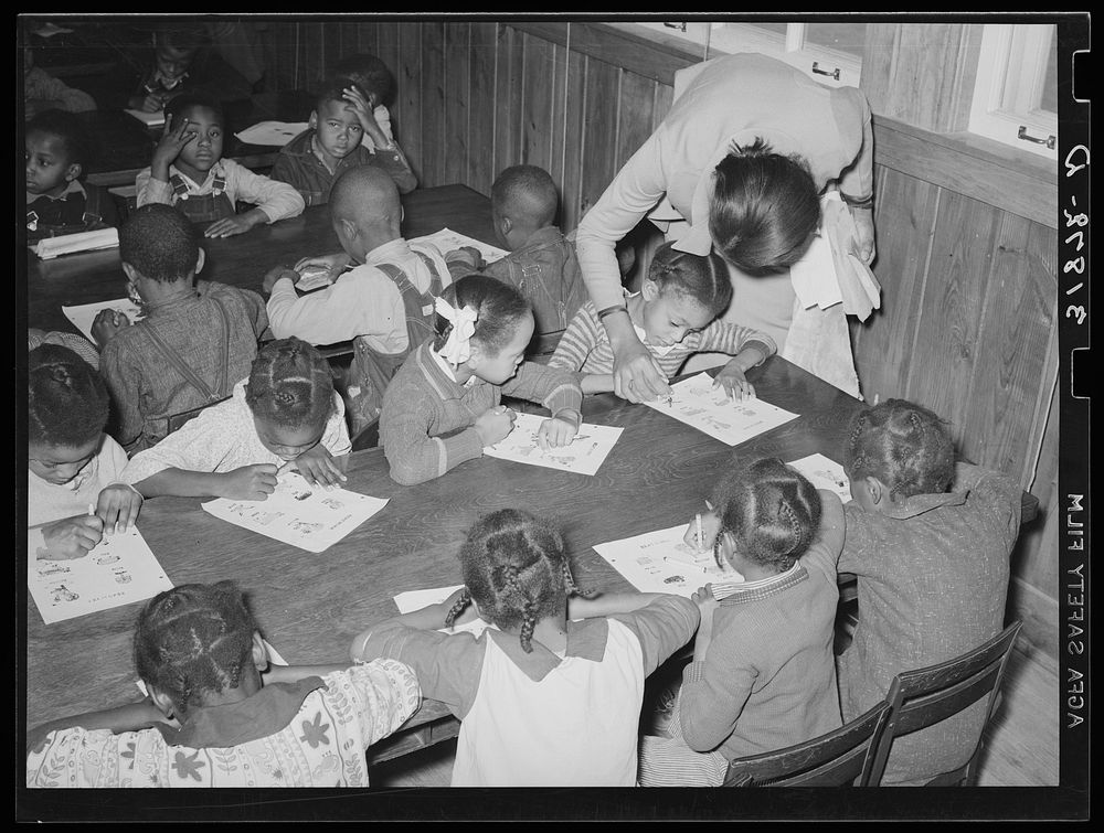 Children receiving instructions in coloring drawings. Lakeview Project, Arkansas by Russell Lee