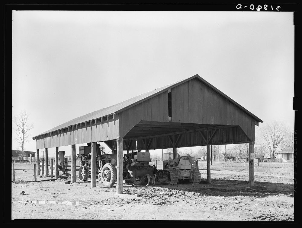 Shed for agricultural machinery. Jerome, Arkansas by Russell Lee
