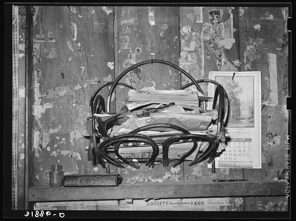 Magazine rack in home of FSA (Farm Security Administration) client who will move onto Transylvania Project. Louisiana by…