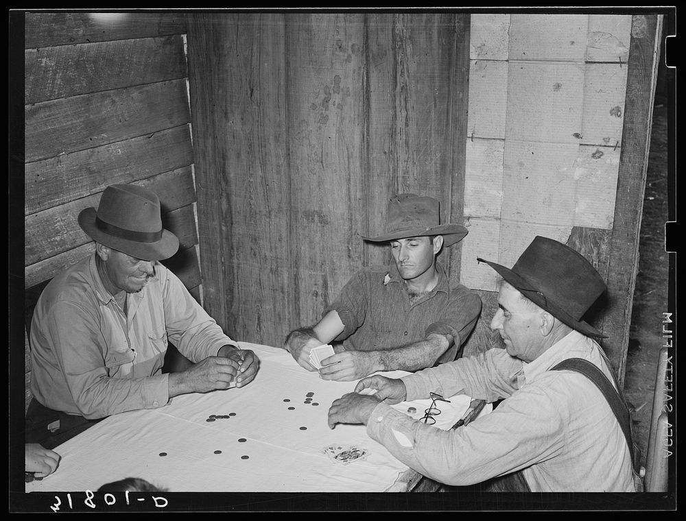 Poker game in home of day laborer, Sunday afternoon. Near New Iberia, Louisiana by Russell Lee