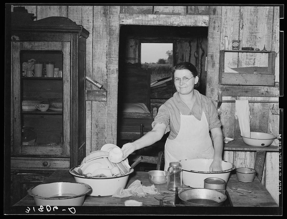 [Untitled photo, possibly related to: Mrs. M. LaBlanc washing dishes in kitchen of her present home. Morganza, Louisiana] by…
