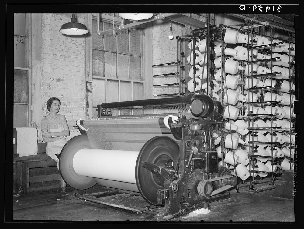 Warp winding machine with operator. Laurel mills, Laurel Mississippi by Russell Lee
