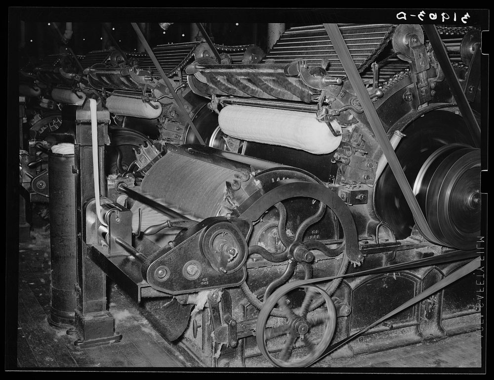 Pulling cotton into cotton "ropes" which, in later processes, are combined to make thread. Laurel mills, Laurel, Mississippi…