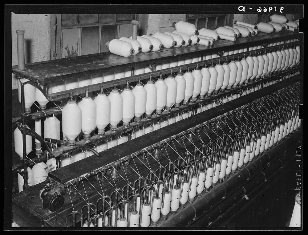 Making three-twist thread. Laurel cotton mills, Laurel, Mississippi by Russell Lee