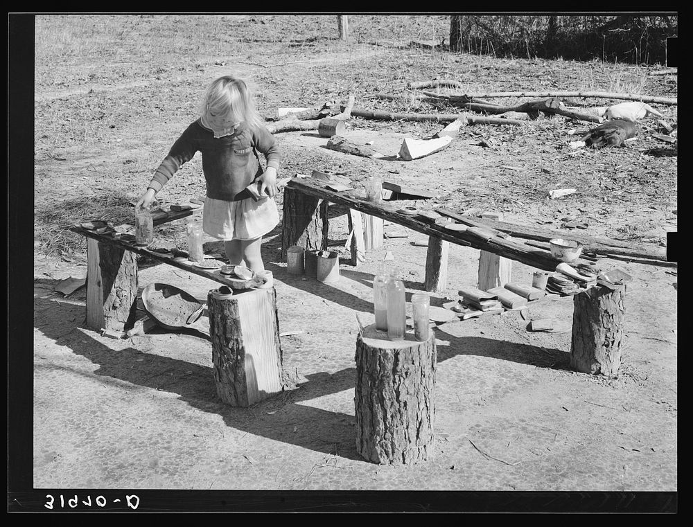 Child of Ed Bagget, sharecropper, playing near Laurel, Mississippi by Russell Lee