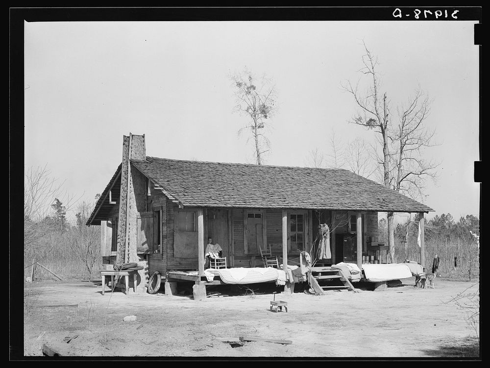 Farmhouse near Antioch with mattresses and bedding being aired. Mississippi by Russell Lee