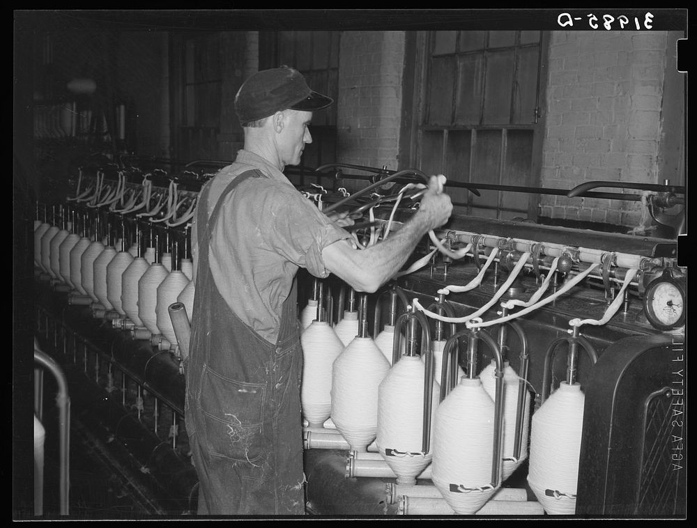 Converting cotton ropes into rough thread. Laurel cotton mills, Laurel, Mississippi by Russell Lee