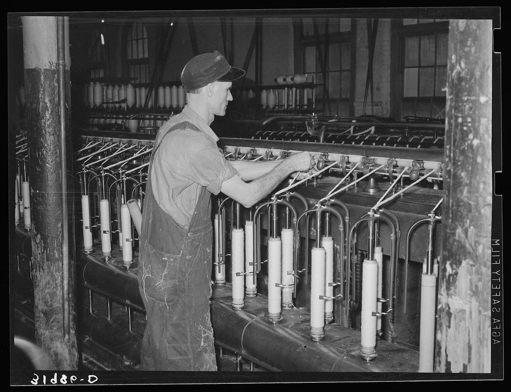 Converting cotton ropes into rough thread. Laurel cotton mills, Laurel, Mississippi by Russell Lee