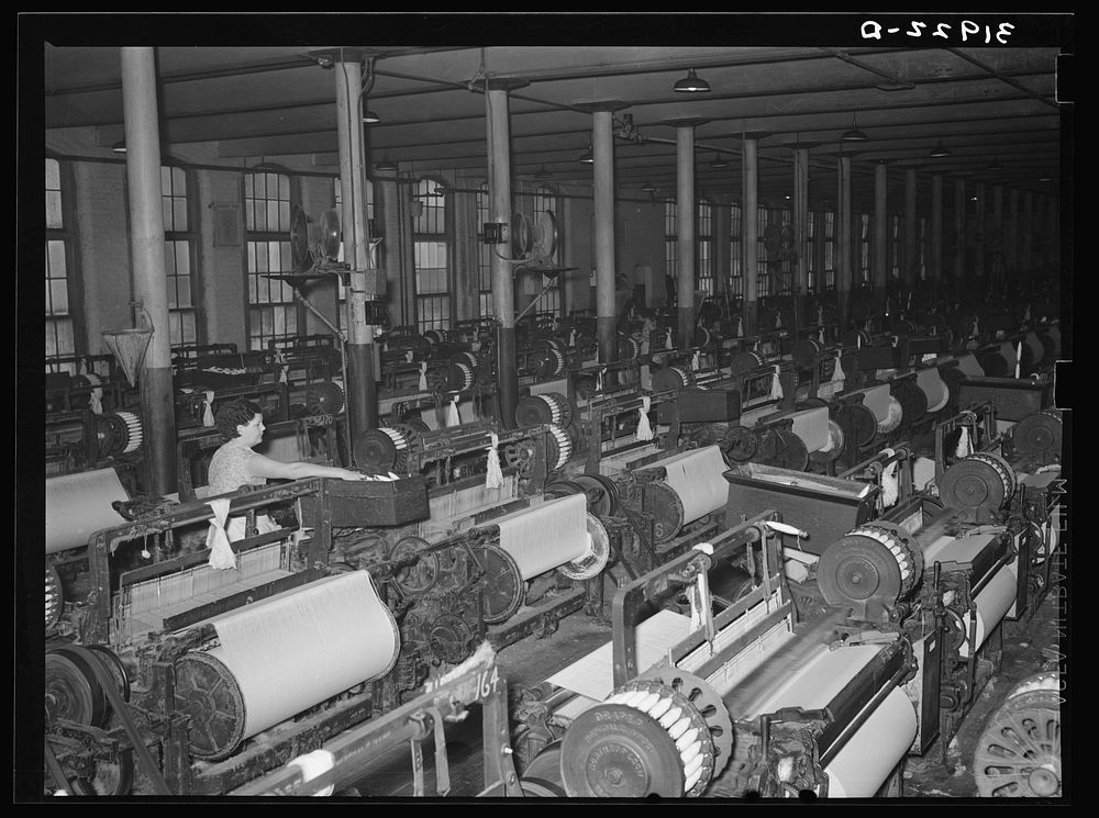 Weaving room, Laurel cotton mill. Laurel, Mississippi by Russell Lee