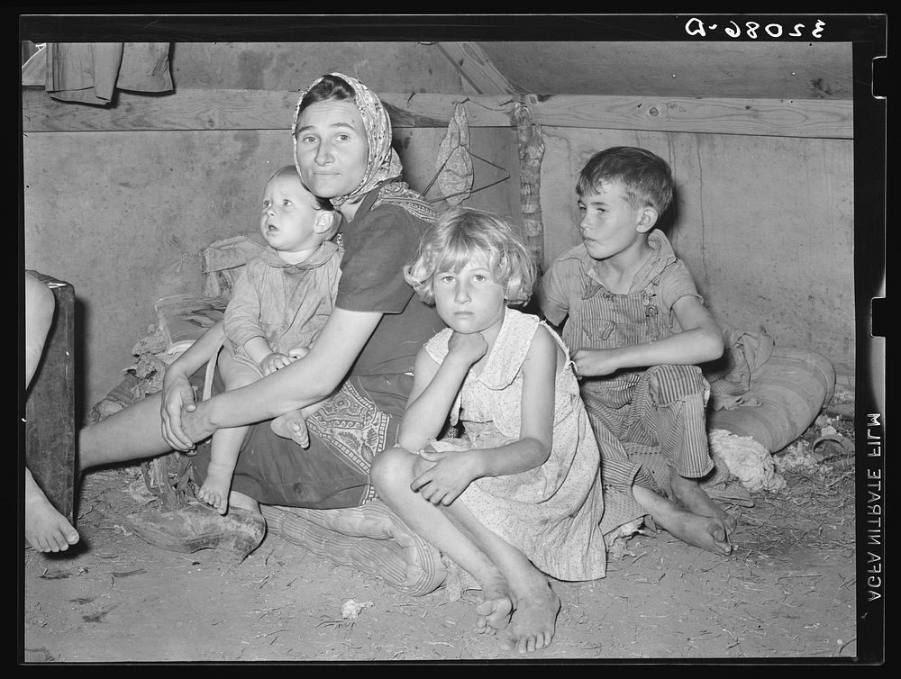 White migrant mother with children. Weslaco, Texas. See general caption 32108-D by Russell Lee